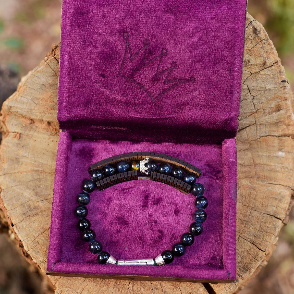 Resilience, like the stones that comprise this bracelet, is rare. Featuring 8mm hand-selected Blue Tiger's Eye beads, each piece features a signature magnetic crown accent in .925 silver, secured by a precision-engineered twist-lock clasp. Presented in our signature purple velvet keepsake box.