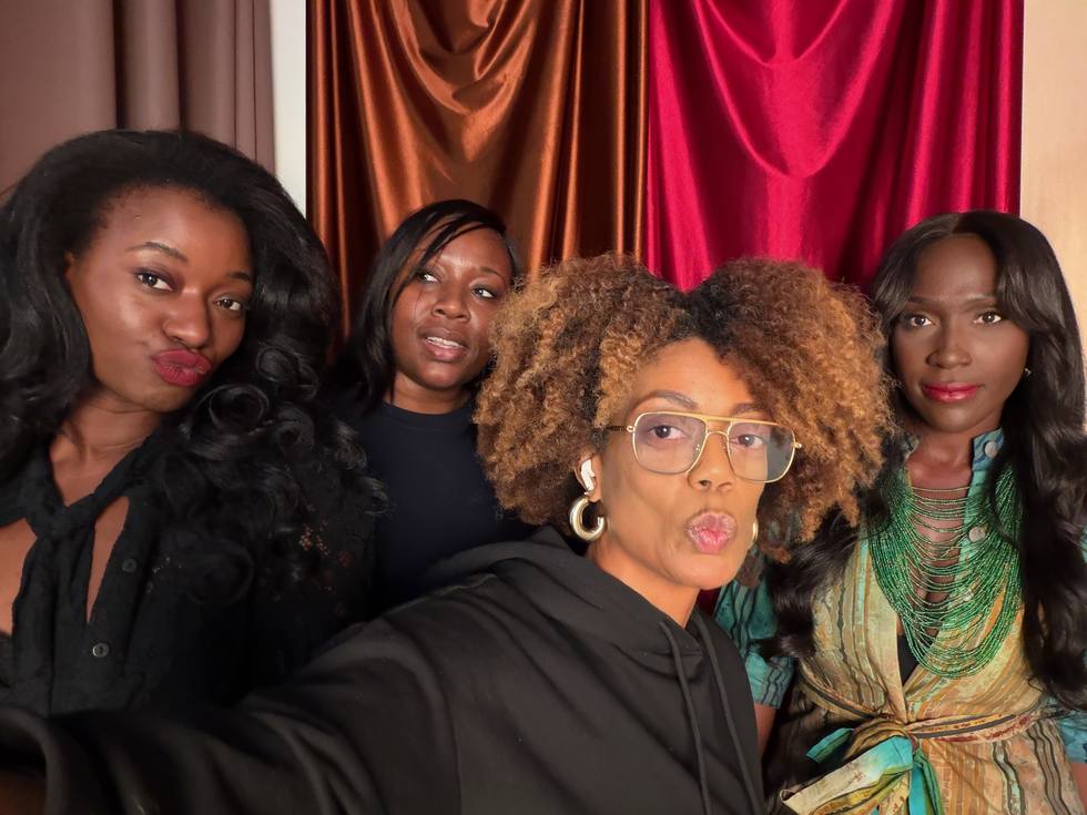 Four women crowded into a selfie between takes on a LOVE DOT shoot.