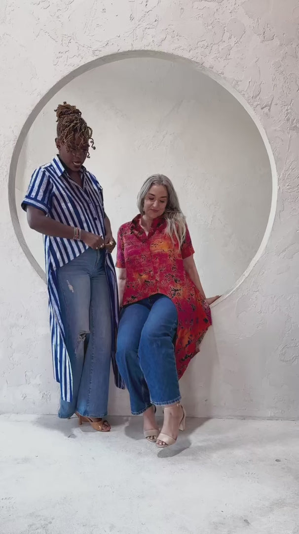 Where heritage meets head-turning design. This asymmetrical masterpiece brings artisanal Ghanaian craftsmanship to your everyday style. From the custom batik print to the fabric-covered buttons, every detail is thoughtfully handcrafted.